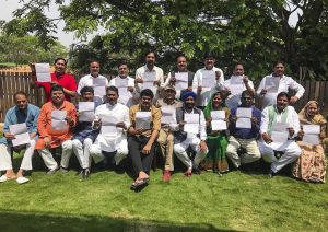 Rebel Congress MLAs from Madhya Pradesh pose with their resignation letters at a Bengaluru resort. Photo: PTI